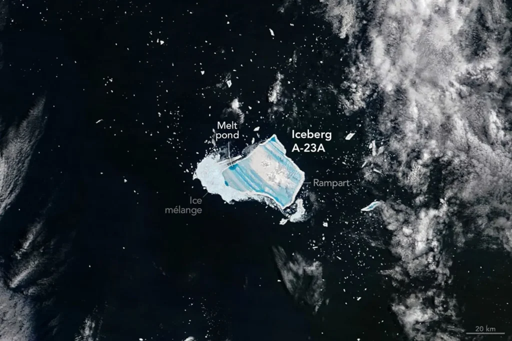 Antarctica from space giant iceberg calving A-23A blue meltwater satellite photograph